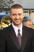 Justin Timberlake in a suit smiling.