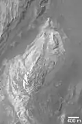 Light toned sedimentary outcrops on the floor of Juventae Chasma.