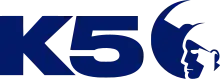 All in deep blue: the bold, wide letters K5 next to a circle containing a negative space cutout of a stylized traditional Hawaiian warrior with headdress