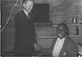 Helen's dad shaking hands with Louie Armstrong.