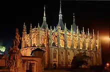 Church of St Barbara, a large Gothic building, at night