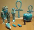 Faience shabti and assorted faience amulets, now in the Metropolitan Museum of Art