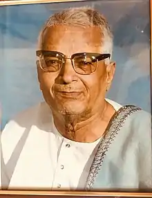 A portrait of K S Narasimhaswamy.