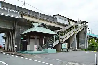 Station entrance. Note steps leading up to the platform. The black plaque commemorates the opening of the Asatō Line. The sign above the roller shutters says "Kaifu Town Tourism Information Centre" - now replaced by a community interaction centre.