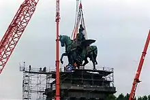 Emil Hundrieser's colossal Equestrian statue of Kaiser Wilhelm I atop the Deutsches Eck was severely damaged in World War II. A copy by Raymond Kittl was installed in 1993.