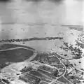 1945 aerial photo of Kallang Airport runway, ramp and terminal building, as well as Kallang Basin area