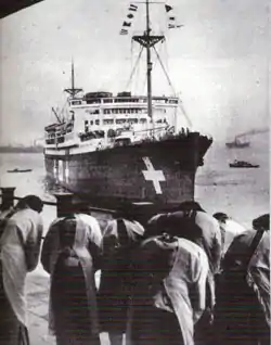 Relatives of four of the Japanese sailors killed in the midget submarines which raided Sydney Harbour greet Kamakura Maru as she arrives at Yokohama with the ashes of the four submariners in October 1942.
