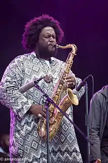 Kamasi Washington playing the saxophone