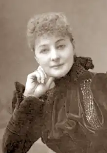 white woman in early middle age looking towards the camera