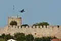 F-16 Block 52+ (from the Greek F-16 Demo Team "Zeus") flying over the Byzantine fortress of Kavala (2014 AirSea Show)