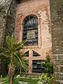 The side windows with several openings for ventilation and one of the Station of the Cross