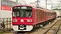 Four car set 1501 in a special Daishi Line all-over red commemorative livery in May 2014