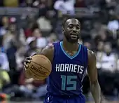 Kemba Walker on the court with a ball in his hands