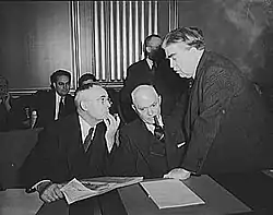 Image 55John L. Lewis (right, President of the United Mine Workers, confers with Thomas Kennedy (left), UMW Secretary-Treasurer of the UMW, and a UMW official at the War Labor Board in 1943 about a coal miners' strike.