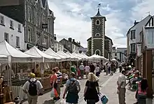 Street market with stalls under canvas roofs