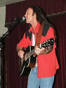 Kevin Welch at Cactus Cafe in Austin, Texas.  Photo by Ron Baker (2005).