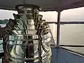 The 5th order Fresnel Lens in Kewaunee's Pierhead lighthouse sees one of its last sunsets before being removed from the tower