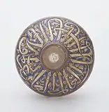 Mamluk enamelled flask. Its shoulder bears a wide band with a dedication to an unnamed sultan in thuluth. Egypt or Syria, first half of the 14th century. Khalili Collection of Islamic Art.