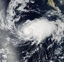 A visible satellite image of a tropical storm approaching hurricane intensity on August 31.