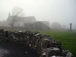 St. Fachtna's Catholic church and the "West Cross" in the mist