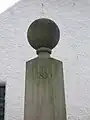 The '1830' date on the Mercat cross.