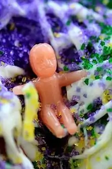 Modern king cake fève in the shape of a baby