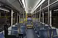 Catalyst interior, looking back from forward aisle. Like other partial low-floor buses, there is a step at the rear axle for mechanical clearance.