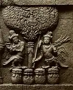 9th century C.E. Kinnaras with cymbals and stick-zither veena; they are standing on tifa-like drums or pots. Bas-relief at Borobudur near Magelang - 1890-1891.