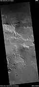 Kipini Crater south rim, as seen by HiRISE. Scale bar is 500 meters long.