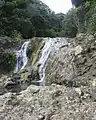 The upper swimming hole is just out of view above this small white water fall.