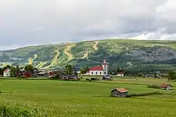June 2014 view of Klövsjö with Klövsjö Church and the skiing hills seen in the background