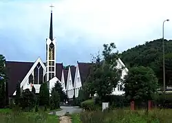 Saint Stanislaus Kostka church with the Oliwa forests in the background