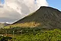 View of Koko Crater from the Kalanianaole Hwy, stairs visible ascending the slope.