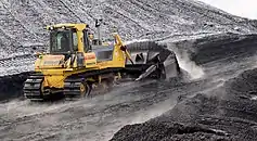 Komatsu Dozer pushing coal on the job site