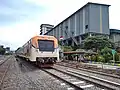 Commuter Line Sindro trainset in Indro Station, Gresik.