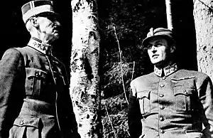 Crown Prince Olav and his father King Haakon VII take shelter under birch trees as the German Luftwaffe bombs Molde