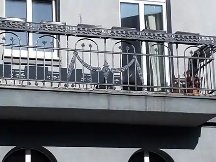Adorned wrought iron balcony