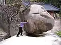 Trying to shake Heundeulbawi (Rocking Rock) at Kyejo-am in Seoraksan National Park