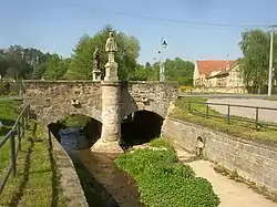 Stone arch bridge over the Bakovský Stream