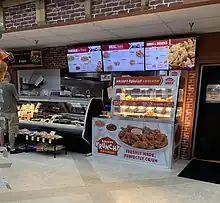 Image of a fried chicken vendor inside a grocery store