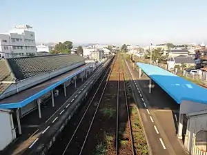 A view of the station platforms and tracks looking in the direction of Tsukuda.