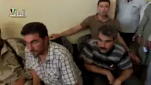 Muhammad Mustafa Ali (left) and Shervan Derwish (right) in Qabasin, July 2013, then as commanders of the Kurdish Front. They would later become commanders of the Northern Sun Battalion.