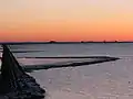 Evening view of the islet with its four warfs and the Lorendamm, seen from the mainland