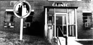 The front entrance of Lincoln Community Health Center. A glass portico and a sign.