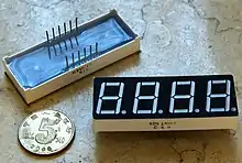 Seven-segment display that can display four digits and points