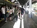 Passengers alighting from a train