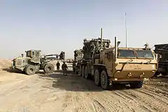 Photographed in Helmand Province, Afghanistan, this MK18 LVSR cargo variant is towing a M1076 PLST