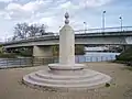 The Royal Engineers memorial on the south bank, with the bridge in the background.