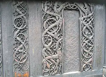 Carvings on door jambs and a wall plank of the north wall