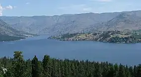 View of Lake Chelan with barren hills in background
